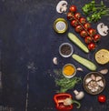 Ingredients for cooking vegetarian food tomatoes on a branch, herbs, cucumber, lemon, garlic, oil, black pepper, paprika, mushroom Royalty Free Stock Photo