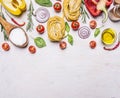 Ingredients for cooking vegetarian pasta with tomatoes, basil, oil, pepper on wooden rustic background top view border ,place Royalty Free Stock Photo