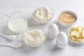 Ingredients for cooking white chocolate coconut muffins: flour, milk or buttermilk, eggs, coconut flakes, white chocolate, brown