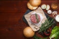 Ingredients for a delicious homemade American burger with a juicy large beef chop