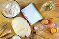 Ingredients for dough, cooking bread, pizza or pie, pasta, including flour, eggs, milk, on wooden rustic background, empty space f Royalty Free Stock Photo
