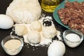 Ingredients for dumplings: dough balls and ground meat