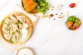 Ingredients dumplings on a white table