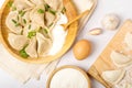 Ingredients dumplings on a white table