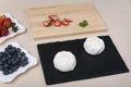 Ingredients for fruit cakes. Berries and meringue on table Royalty Free Stock Photo
