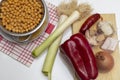 Ingredients for a good stew traditional cuisine of cooked, chorizo, chickpeas, leeks, red pepper, onion, bacon, piece of ham bone