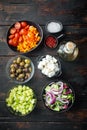 Ingredients for greek salad, on old dark  wooden table background, top view flat lay Royalty Free Stock Photo