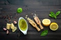 The ingredients for green pesto sauce on dark wooden background Royalty Free Stock Photo