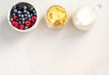 Ingredients for a healthy breakfast Cornflakes, raspberries, blackberries, blueberries on a white background Royalty Free Stock Photo