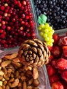 Ingredients for a healthy breakfast nuts, berries, fruits, food for heart, rich with resveratrol, vitamin, antioxidants Top view Royalty Free Stock Photo