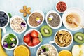 Ingredients for healthy breakfast, nuts, oatmeal, honey, berries, fruits, blueberry, orange, Edible flowers, Chia seeds