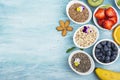 Ingredients for a healthy breakfast, nuts, oatmeal, honey, berries, fruits, blueberry, orange, Edible flowers, Chia