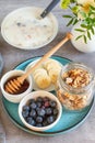 Ingredients for a healthy breakfast: yogurt, muesli, fruits and honey Royalty Free Stock Photo