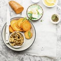 Ingredients for a healthy and comfortable diet: slices of fresh raw sweet potato, honey, walnuts, rosemary cheese, sage Royalty Free Stock Photo