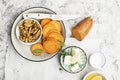 Ingredients for a healthy and comfortable diet: slices of fresh raw sweet potato, honey, walnuts, rosemary cheese, sage Royalty Free Stock Photo