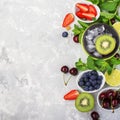 Ingredients healthy diet family meals: fresh juicy fruits and berries with mint and ice to prepare a healthy summer Royalty Free Stock Photo