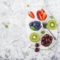 Ingredients healthy diet family meals: fresh juicy fruits and berries with mint and ice to prepare a healthy summer Royalty Free Stock Photo