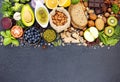 Ingredients for the healthy foods selection. The concept of healthy food set up on dark stone background Royalty Free Stock Photo