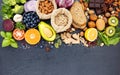 Ingredients for the healthy foods selection. The concept of healthy food set up on dark stone background Royalty Free Stock Photo