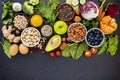 Ingredients for the healthy foods selection. The concept of healthy food set up on dark stone background Royalty Free Stock Photo