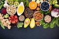 Ingredients for the healthy foods selection. The concept of healthy food set up on dark stone background Royalty Free Stock Photo