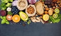 Ingredients for the healthy foods selection. The concept of healthy food set up on dark stone background Royalty Free Stock Photo