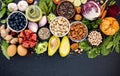 Ingredients for the healthy foods selection. The concept of healthy food set up on dark stone background Royalty Free Stock Photo