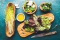 Ingredients for healthy salad - lettuce, sprouts, edibles flowers and arugula. Flat lay, copy space food. Detox. Organic Royalty Free Stock Photo