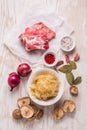 Ingredients for hearty sour cabbage soup sauerkraut soup with meat, onioc, garlic and spicies Royalty Free Stock Photo
