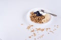 Ingredients for homemade oatmeal granola in glass jar. Oat flakes, honey, raisins and nuts. Healthy breakfast concept with copy Royalty Free Stock Photo