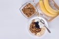 Ingredients for homemade oatmeal granola in glass jar. Oat flakes, honey, raisins and nuts. Healthy breakfast concept with copy Royalty Free Stock Photo