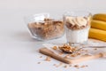 Ingredients for homemade oatmeal granola in glass jar. Oat flakes, honey, raisins and nuts. Healthy breakfast concept Royalty Free Stock Photo