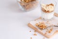 Ingredients for homemade oatmeal granola in glass jar. Oat flakes, honey, raisins and nuts. Healthy breakfast concept Royalty Free Stock Photo