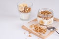 Ingredients for homemade oatmeal granola in glass jar. Oat flakes, honey, raisins and nuts. Healthy breakfast concept Royalty Free Stock Photo