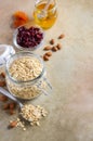 Ingredients for homemade oatmeal granola. Oat flakes, honey, almond nuts, dried cranberries and apricots. Healthy breakfast concep Royalty Free Stock Photo