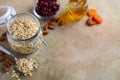 Ingredients for homemade oatmeal granola. Oat flakes, honey, almond nuts, dried cranberries and apricots. Healthy breakfast concep Royalty Free Stock Photo