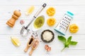 The ingredients for homemade pesto pasta on white wooden background. Royalty Free Stock Photo