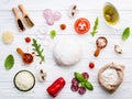 The ingredients for homemade pizza on white wooden background Royalty Free Stock Photo