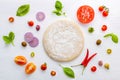 The ingredients for homemade pizza on white wooden background Royalty Free Stock Photo