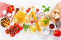 Ingredients for italian cousine flat lay, pasta spaghetti penne fusilli tomato oil vegetables Royalty Free Stock Photo