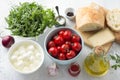 Ingredients for italian panzanella salad: cherry, arugula, basil, mozzarella, ciabatta bread, parmesan cheese, olive oil Royalty Free Stock Photo