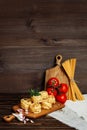 Ingredients for Italian Pasta on wooden table. Picture with free space for text. Royalty Free Stock Photo