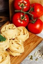 Ingredients for Italian Pasta on wooden table. Royalty Free Stock Photo