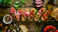 Ingredients for Italian snack, bruschetta, crostini or sandwich bar with Italian ham, sausage and antipasto on rustic wooden