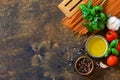 Ingredients for italy cuisine. Tomato spaghetti, herbs spices, olive oil and vegetables on a wooden table. Royalty Free Stock Photo