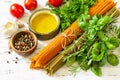 Ingredients for italy cuisine. Tomato and spinach spaghetti, herbs spices, olive oil and vegetables. Royalty Free Stock Photo