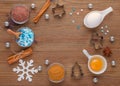 Ingredients and kitchen tools for dessert baking on wooden background