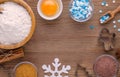 Ingredients and kitchen tools for dessert baking on wooden background
