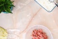 Ingredients for lazy cabbage rolls on table. Frozen cabbage, fried onions and carrots, half-baked rice. Copy space.