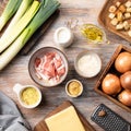Ingredients for leek cheese soup with croutons and bacon on a wooden table. cheese, onion, leek, olive oil, bacon, garlic, mustard Royalty Free Stock Photo